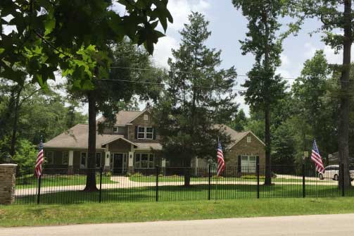 House with multiple flag installation.